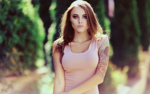Girl with a right arm tat