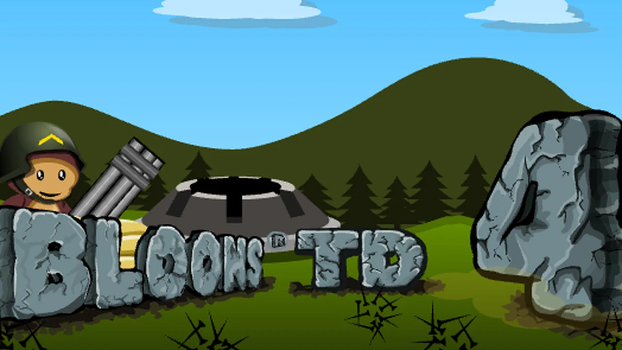 Bloons Tower Defense 4 monkey towers and tack shooters popping colored bloon waves along winding track