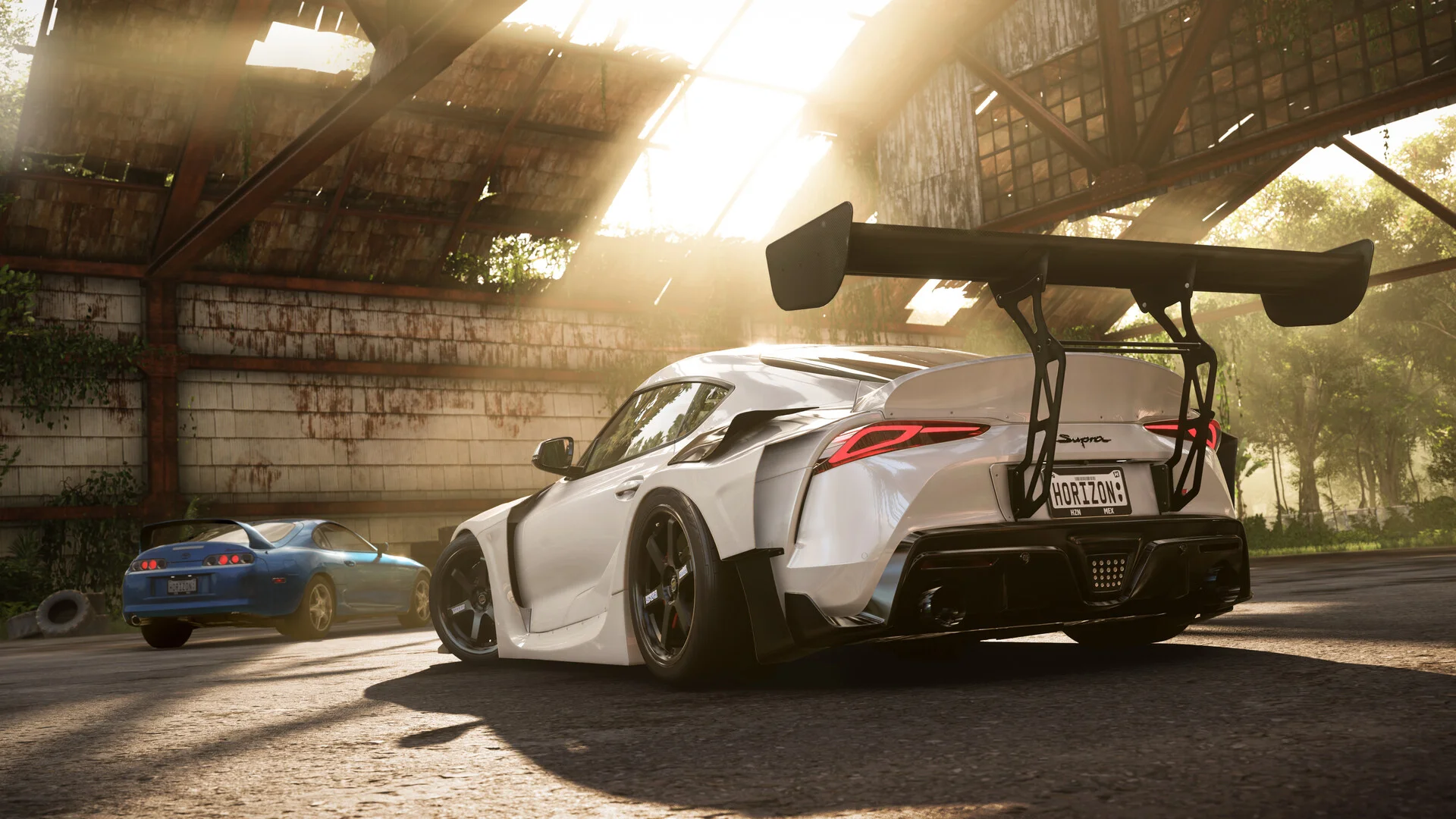 High-performance sports car racing down an open highway beside dramatic festival landmarks in Forza Horizon