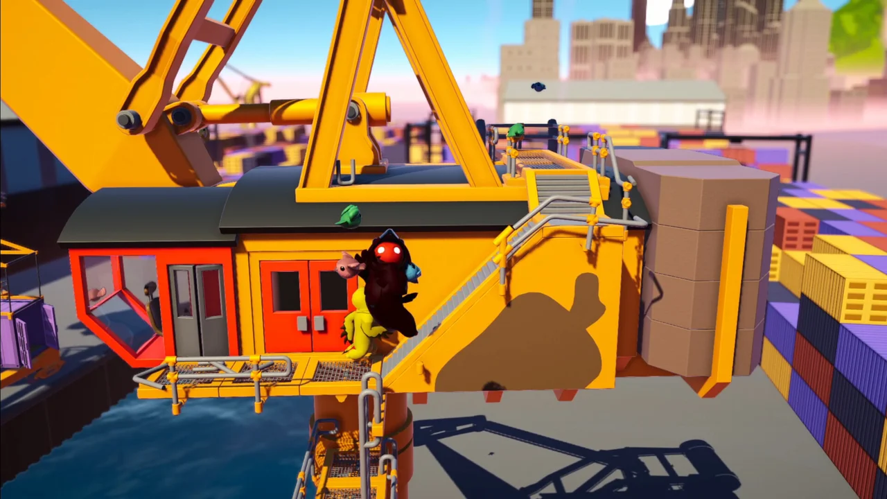 Gang Beasts rooftop construction site brawl with gelatinous fighters tussling near a crane and railway car