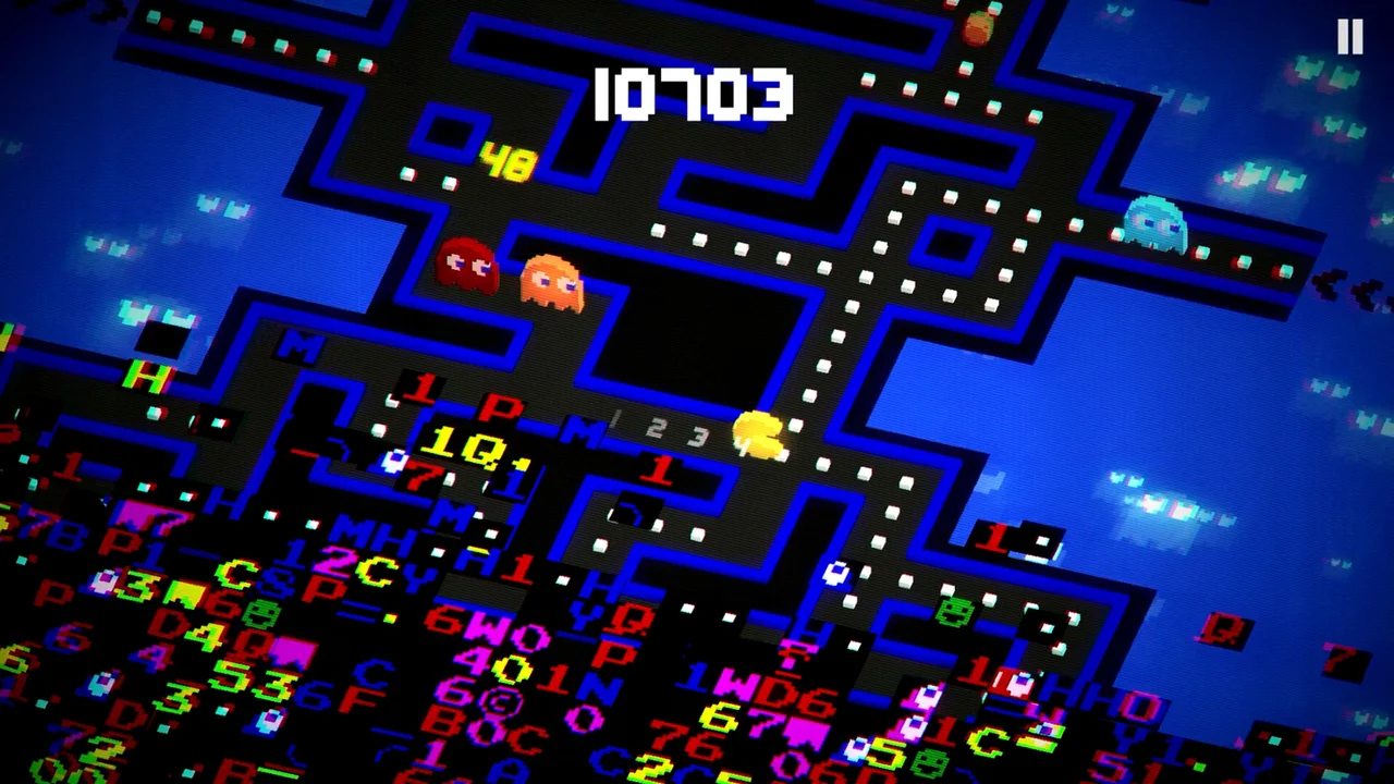 Gameplay screenshot of PAC-MAN 256 showing the iconic yellow hero eating pellets in an isometric maze with ghost chasers