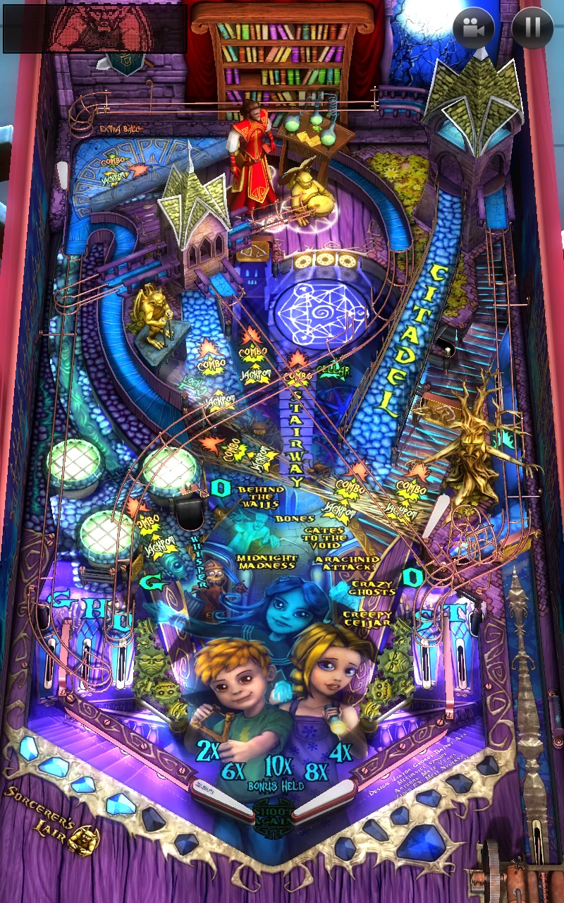 Close-up arcade pinball view of Zen Pinball Marvel table showing flippers, ramps, and superhero targets